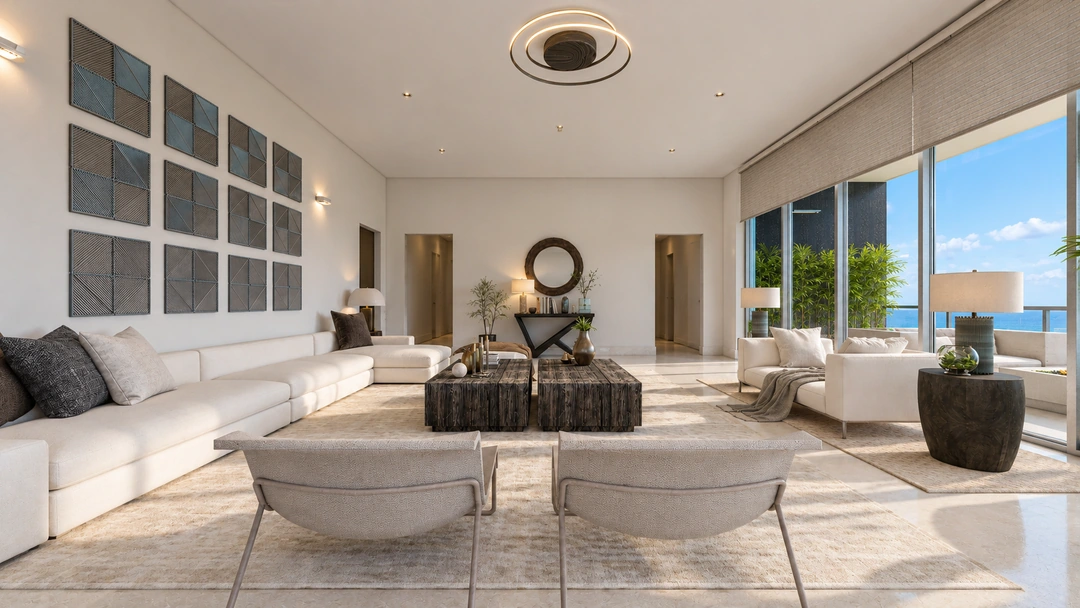 Pale lounge seating facing a circular mirror and framed art — Miami, FL — Real Estate, Studio Dalika; project view 4