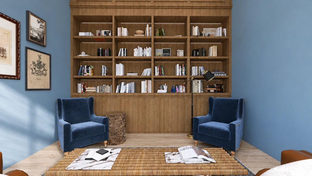 Two blue chairs facing a full-height timber bookcase — Houston, TX — Boutique Hotel Reading Room, Studio Dalika; project view 3