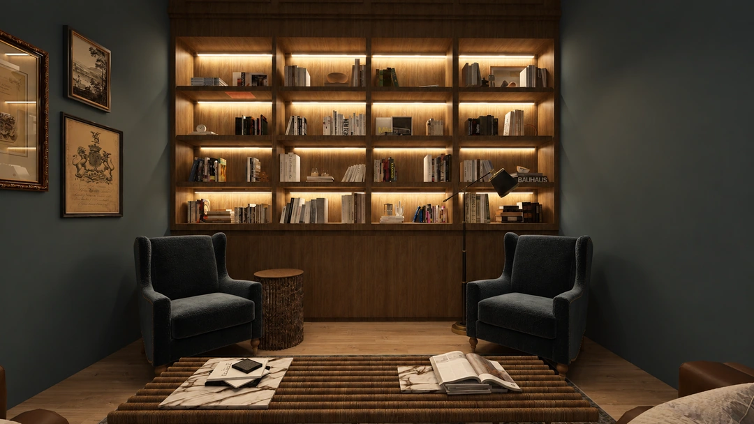 Night reading corner with blue chairs and lit shelves — Houston, TX — Boutique Hotel Reading Room, Studio Dalika; project view 4